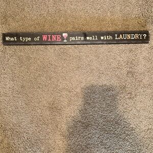 “What type of wine pairs well with laundry?” sign